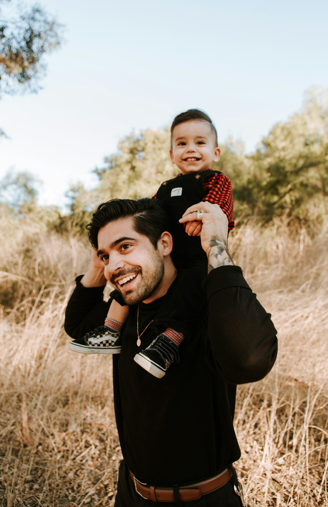 Portrait of a Latino man in his 40s with short hair and a gentle smile wearing a casual shirt