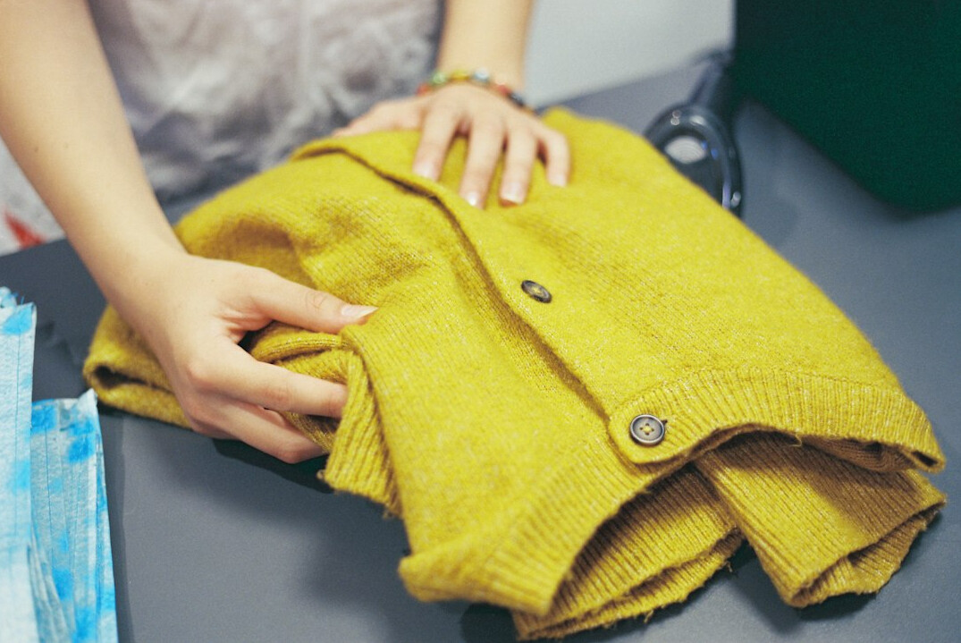 woman folding clothes neatly